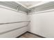 Walk in closet with shelving and wood flooring at 10172 Woodrose Ln, Highlands Ranch, CO 80129