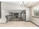 Open concept living space featuring tile floors, high ceilings, and staircase at 10172 Woodrose Ln, Highlands Ranch, CO 80129