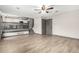 Open floor plan with wood floors, and stairs up to the kitchen at 10172 Woodrose Ln, Highlands Ranch, CO 80129