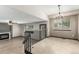Open concept living space with fireplace, wood floors, and staircase at 10172 Woodrose Ln, Highlands Ranch, CO 80129
