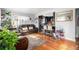 Open-concept space featuring hardwood floors connecting the living room to the kitchen, great for entertaining at 7066 Jennie Dr, Denver, CO 80221