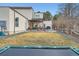 Spacious backyard with a covered patio, lush lawn, and plenty of room for outdoor activities at 4795 Highline Pl, Denver, CO 80222