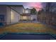 Expansive backyard with a covered patio, lush lawn, and plenty of room for outdoor activities at 4795 Highline Pl, Denver, CO 80222
