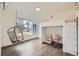 Bedroom features a stylish loft bed with integrated desk, a modern hanging chair, and lots of natural light at 4795 Highline Pl, Denver, CO 80222