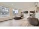 Bright bonus room with two bean bag chairs, modern shelving, and large windows providing natural light at 4795 Highline Pl, Denver, CO 80222
