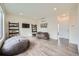 Bright bonus room with two bean bag chairs, modern shelving, and large windows allowing for natural light at 4795 Highline Pl, Denver, CO 80222