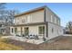 Contemporary two-story home boasts a modern design with a spacious patio at 4795 Highline Pl, Denver, CO 80222