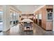 Bright, modern kitchen features an island with seating, ample storage, and stainless steel appliances at 4795 Highline Pl, Denver, CO 80222
