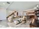 Spacious open-concept living room with concrete floors and views to the kitchen and dining area at 4795 Highline Pl, Denver, CO 80222