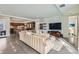 Open-concept living space with sleek concrete floors and modern furniture at 4795 Highline Pl, Denver, CO 80222
