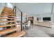 Bright home with modern staircase leading to an open-concept dining and kitchen area at 4795 Highline Pl, Denver, CO 80222