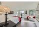 Bright main bedroom with large windows, a comfortable bed, and stylish decor creating a relaxing atmosphere at 4795 Highline Pl, Denver, CO 80222