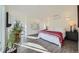 Bright and airy main bedroom features a comfortable bed, stylish decor, and ample natural light at 4795 Highline Pl, Denver, CO 80222