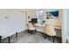 Office with built-in desk, two stylish chairs, and a large window offering natural light at 4795 Highline Pl, Denver, CO 80222