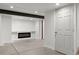 Unfinished basement with recessed lighting and electric fireplace at 16530 Timber Cove St, Hudson, CO 80642