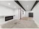 Unfinished basement with recessed lighting and electric fireplace at 16530 Timber Cove St, Hudson, CO 80642