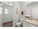 Clean bathroom with single vanity and toilet at 16530 Timber Cove St, Hudson, CO 80642