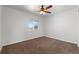 Bright bedroom with ceiling fan and carpeting at 16530 Timber Cove St, Hudson, CO 80642