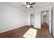 Bright bedroom with ceiling fan and closet at 16530 Timber Cove St, Hudson, CO 80642