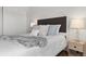 Bright bedroom with a double bed and nightstand at 16530 Timber Cove St, Hudson, CO 80642