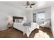 Bedroom with ceiling fan and ample sunlight at 16530 Timber Cove St, Hudson, CO 80642