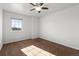 Spacious bedroom with ceiling fan and window at 16530 Timber Cove St, Hudson, CO 80642