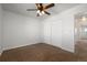 Spacious bedroom with double doors leading to the closet and hallway at 16530 Timber Cove St, Hudson, CO 80642