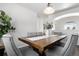 Bright dining area with a wooden table and seating for six at 16530 Timber Cove St, Hudson, CO 80642