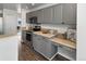 Modern kitchen with gray cabinets and ample counter space at 16530 Timber Cove St, Hudson, CO 80642