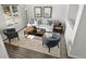 Living room with hardwood floors and comfortable seating at 16530 Timber Cove St, Hudson, CO 80642