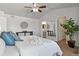 Main bedroom with ensuite bathroom and a ceiling fan at 16530 Timber Cove St, Hudson, CO 80642