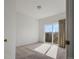 Bedroom with sliding glass door leading to outdoor space and carpet flooring at 12292 E 2Nd Dr, Aurora, CO 80011