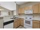 A kitchen showcasing a breakfast bar that connects to an adjacent living space at 12292 E 2Nd Dr, Aurora, CO 80011