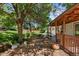 This backyard features a patio, lush lawn, mature tree, and a grill for outdoor entertaining at 4627 S Norfolk Way, Aurora, CO 80015