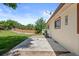 Backyard showcasing the home's exterior and spacious, well-maintained lawn with mature trees at 4627 S Norfolk Way, Aurora, CO 80015