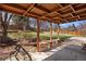Inviting backyard patio with a covered seating area and meticulously landscaped yard at 4627 S Norfolk Way, Aurora, CO 80015