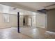 Finished basement with carpeted area and tile flooring at 4627 S Norfolk Way, Aurora, CO 80015