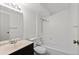 A clean and well-lit bathroom with a shower-tub combination and classic fixtures at 4627 S Norfolk Way, Aurora, CO 80015