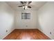 Neutral bedroom with hardwood flooring, white walls, and large window bringing in lots of natural light at 4627 S Norfolk Way, Aurora, CO 80015