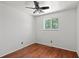 Empty bedroom showcasing hardwood floors and a bright window at 4627 S Norfolk Way, Aurora, CO 80015