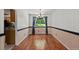 Dining room featuring hardwood floors and a modern chandelier fixture at 4627 S Norfolk Way, Aurora, CO 80015