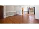 Spacious dining area with hardwood floors, stylish chandelier, and staircase at 4627 S Norfolk Way, Aurora, CO 80015
