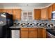 Kitchen features granite countertops, stainless steel appliances, and sleek backsplash at 4627 S Norfolk Way, Aurora, CO 80015