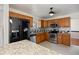 Updated kitchen with stainless steel appliances, granite countertops, and oak cabinets at 4627 S Norfolk Way, Aurora, CO 80015