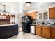 Open kitchen showcasing granite counters, stainless appliances, and access to the backyard at 4627 S Norfolk Way, Aurora, CO 80015