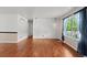 Bright living room with hardwood floors, neutral walls, and pendant lighting at 4627 S Norfolk Way, Aurora, CO 80015
