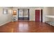 Inviting living room boasts hardwood floors, natural light from large windows, and neutral walls at 4627 S Norfolk Way, Aurora, CO 80015