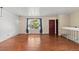 Spacious living room showcasing gleaming hardwood floors and a large window at 4627 S Norfolk Way, Aurora, CO 80015