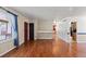 Open-concept living area with hardwood floors and a view of the staircase at 4627 S Norfolk Way, Aurora, CO 80015