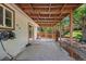 The patio features ample space, bench seating, and direct access to the landscaped backyard at 4627 S Norfolk Way, Aurora, CO 80015